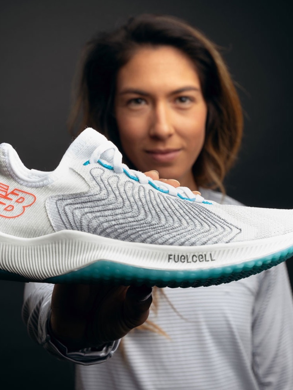 New Balance Women's White Running Shoe with Teal Accents